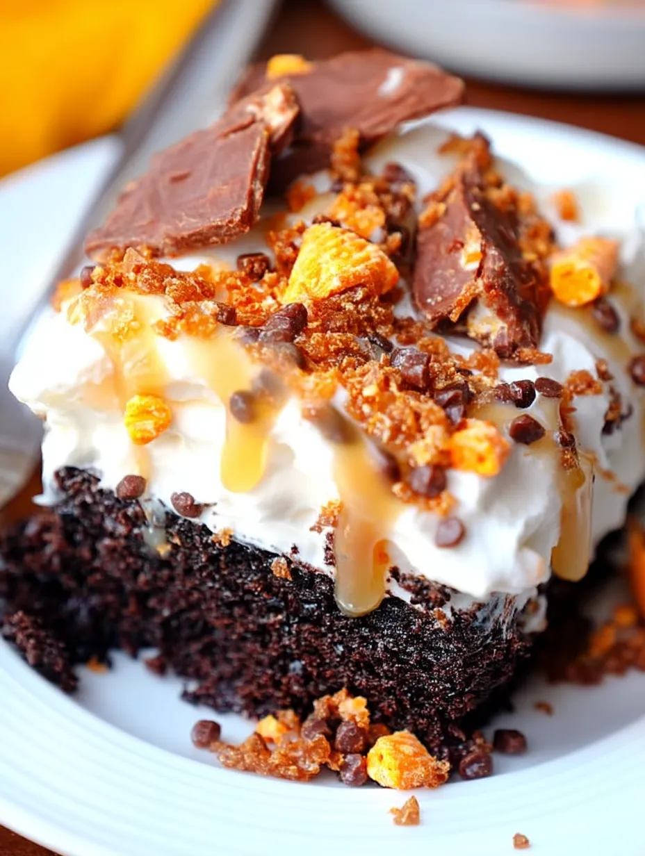 A slice of cake with chocolate and caramel drizzle.