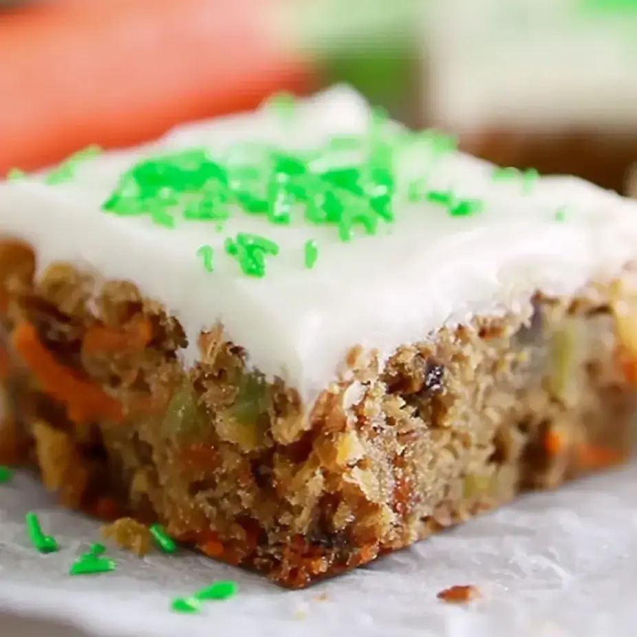 A slice of cake with green frosting.