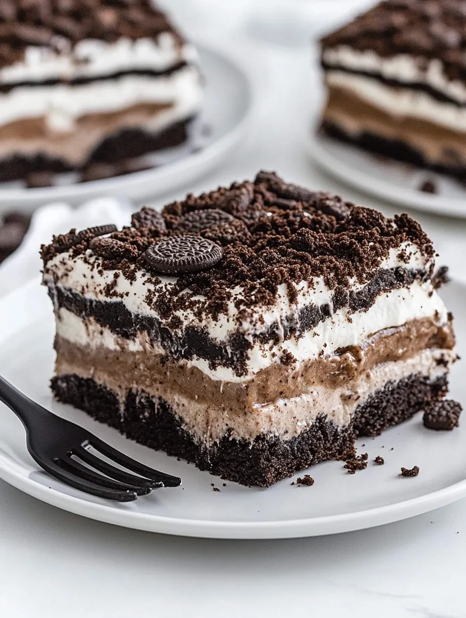 Chocolate dessert slice topped with Oreo cookies.