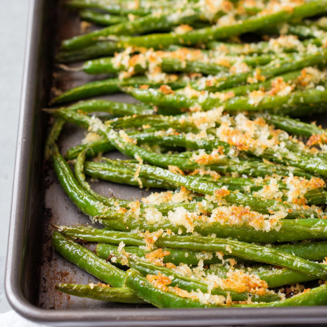 Pan of cheesy topped green beans.