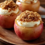 Two apple desserts topped with cinnamon crumbs.