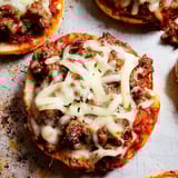 Close-up shot of a meat and cheese topped pizza.