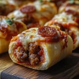 A slice of pizza roll with cheese and pepperoni.
