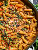 A bowl of creamy sausage rigatoni.