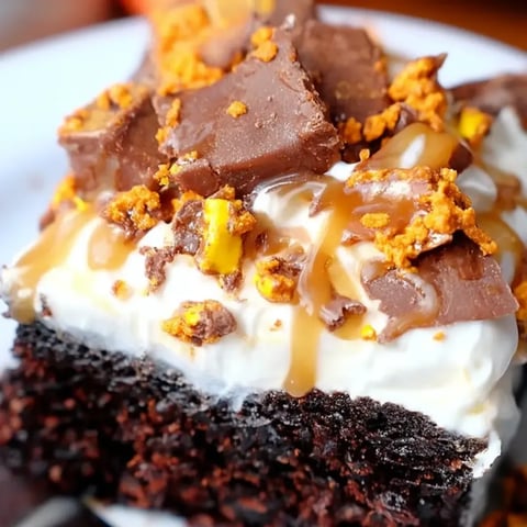 A slice of chocolate cake with caramel drizzle.