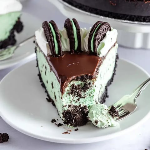 A slice of cake with chocolate and white frosting.