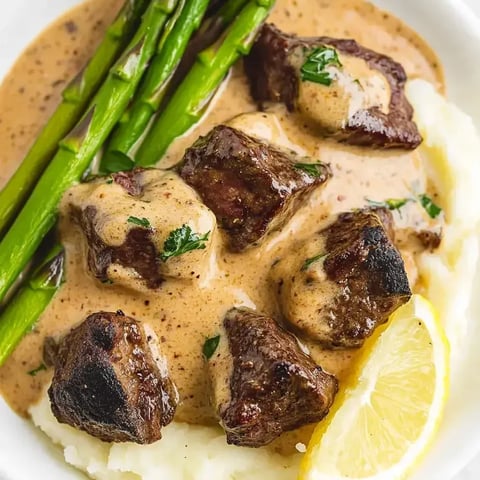 A bowl of meat and vegetables.