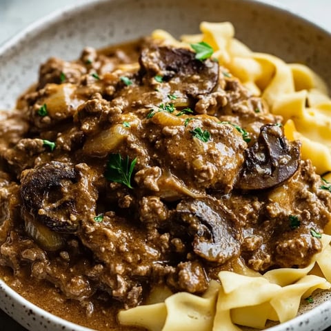 A bowl of noodles with creamy beef.