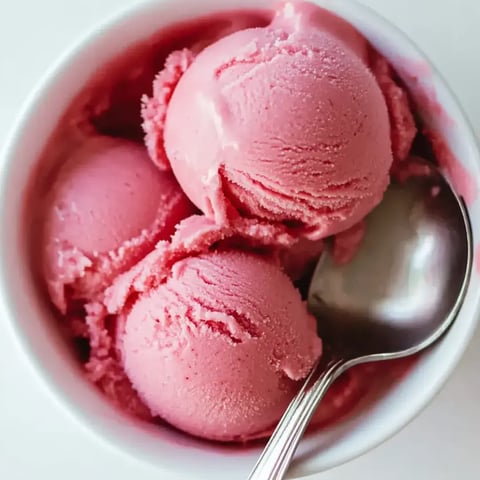 A bowl of pink ice cream.