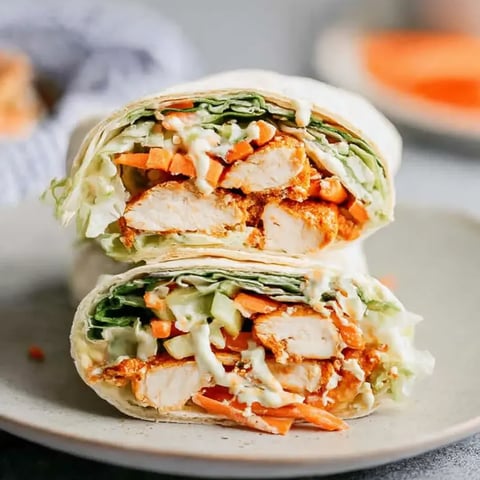 A sandwich with chicken and vegetables.