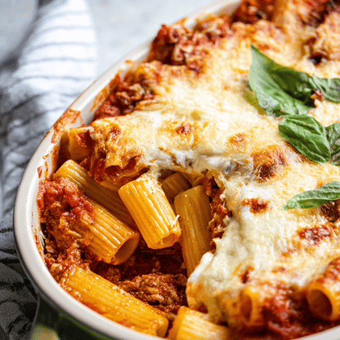 Big bowl piled with melty pasta, greens, and gooey cheese.