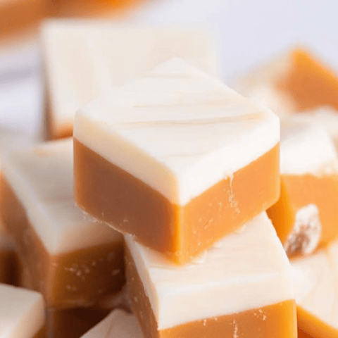 A stack of orange and white layered squares.