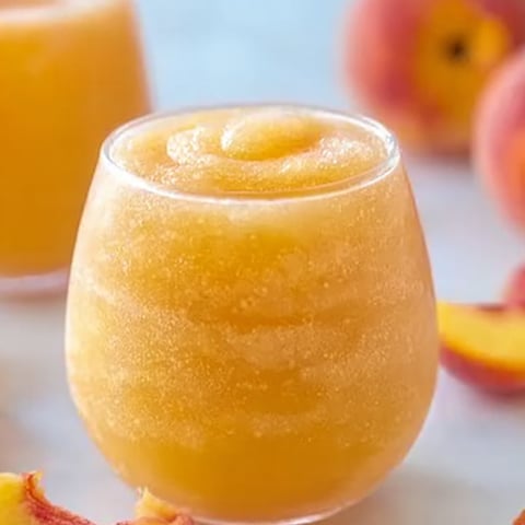 A glass of peach juice.