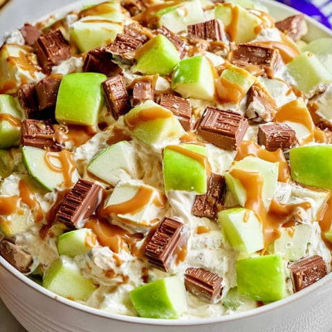 A bowl with fruit and chocolate sauce on top.