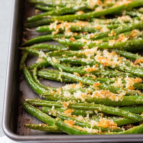 Pan of cheesy topped green beans.