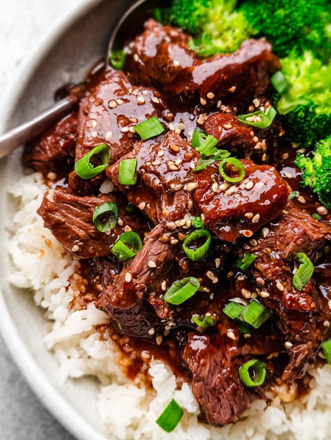 A bowl of slow cooker Korean beef with broccoli.