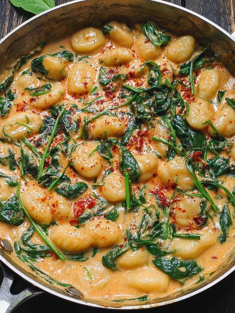 A creamy spinach gnocchi dish.