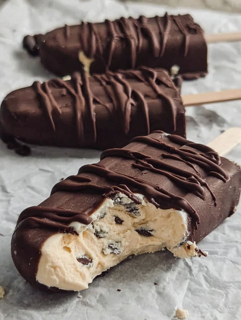 Close-up of a frozen treat with white and chocolate layers.