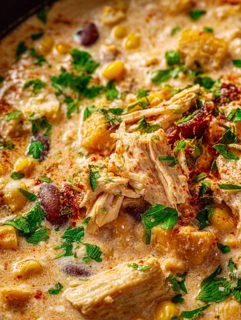Close-up of chili in a bowl with chicken and veggies
